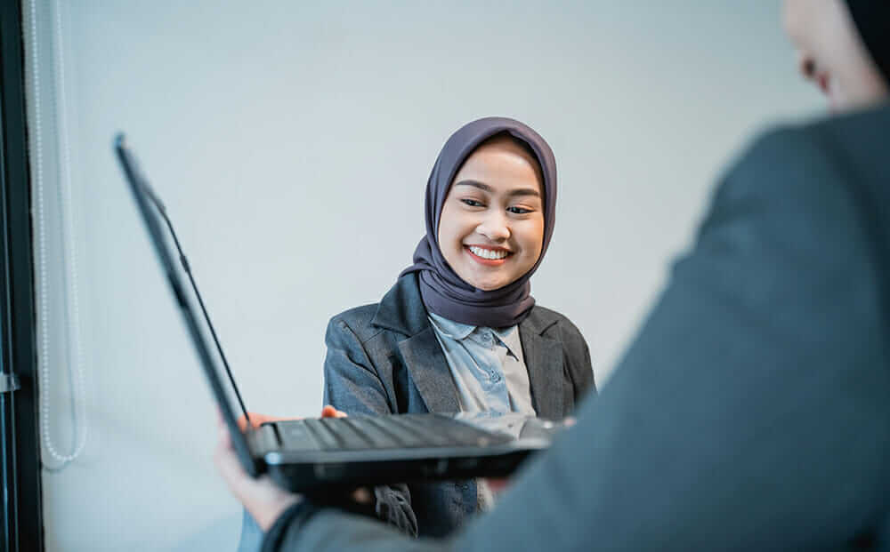 muslim female worker presentation with her partner office
