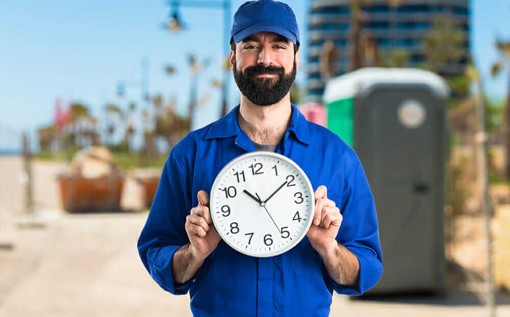 plumber holding clock